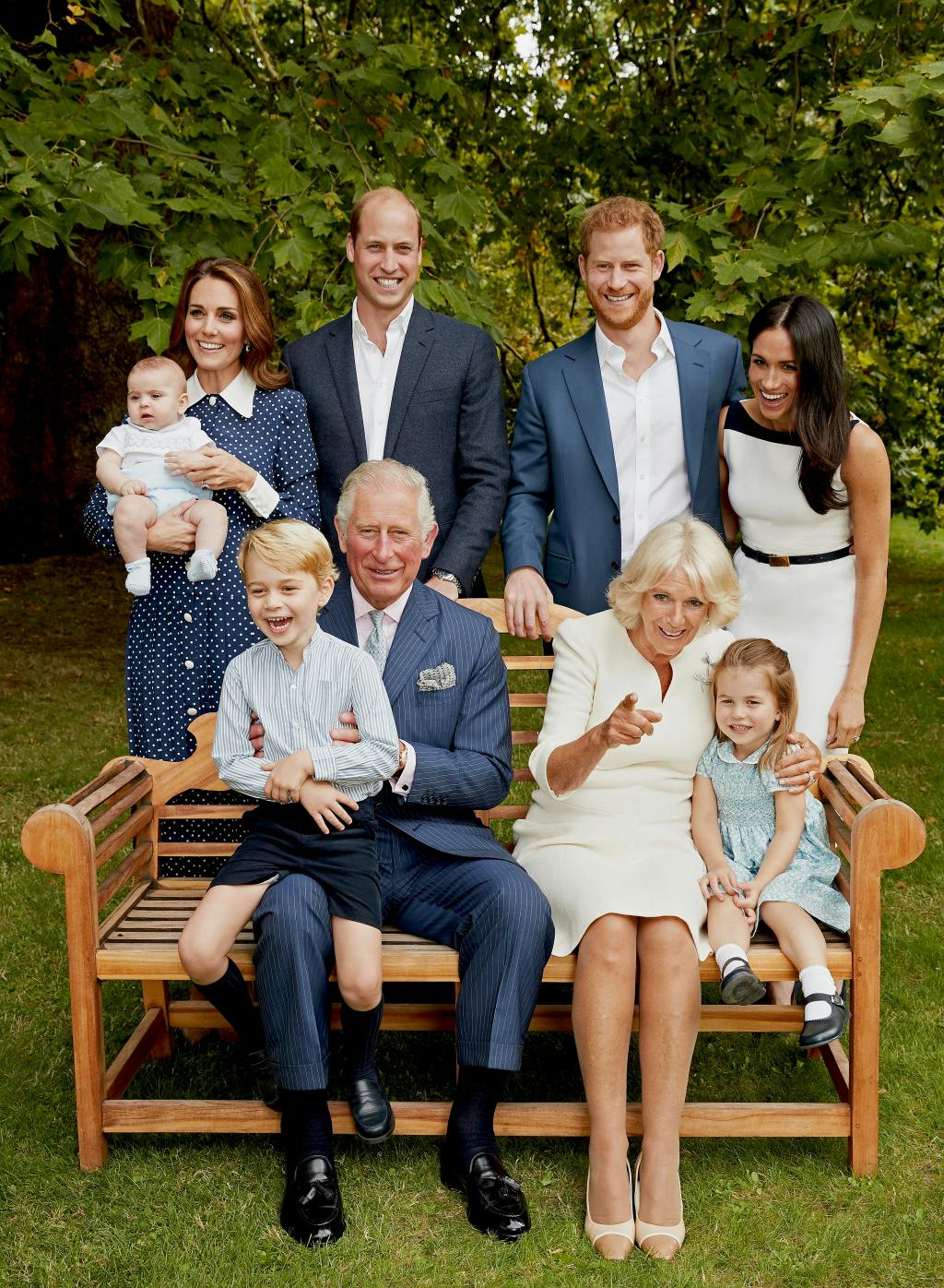 HRH Prince Charles, Prince of Wales poses for an official portrait to mark his 70th Birthday in the gardens of Clarence House, with Their Royal Highnesses Camilla Duchess of Cornwall, Prince Willliam Duke of Cambridge, Catherine Duchess of Cambridge, Prince George, Princess Charlotte, Prince Louis, Prince Harry Duke of Sussex and Meghan Duchess of Sussex, on September 5, 2018. The family grouping looks relaxed and smiling.