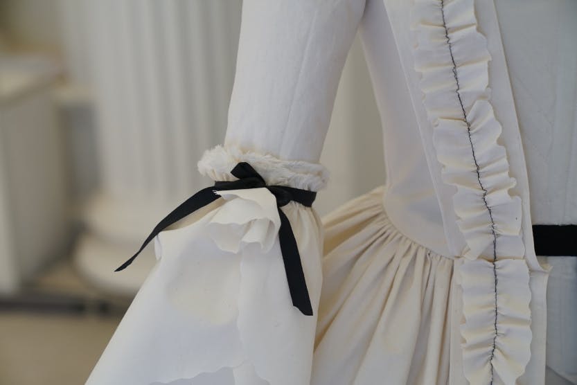 Detail of one of the ruffled sleeves on a toile inspired by Oliver Messel