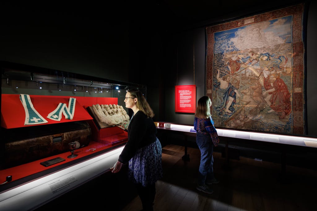 Two HRP staff members looking at exhibits in the HCP Wolsey Room, Tudor World exhibition space.