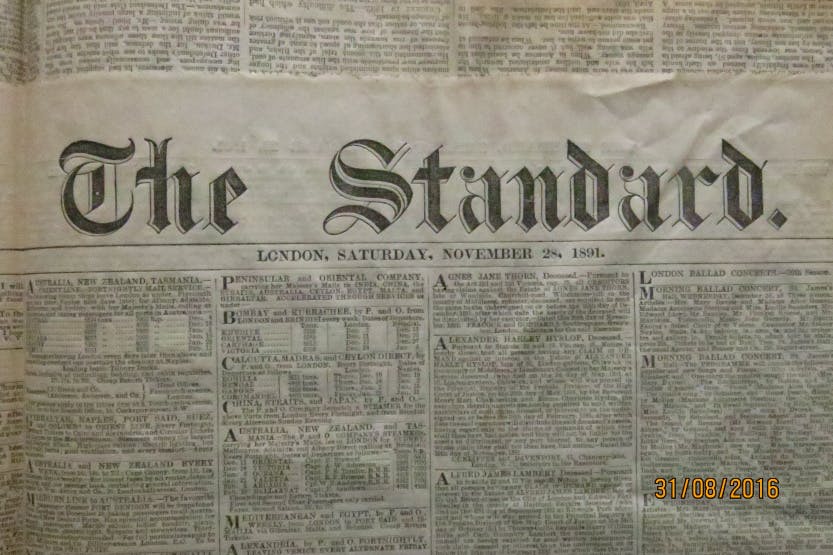 Close up of The Standard newspaper dated Saturday 28th November 1891. The page in view is about ships leaving Britain for the colonies and their timetables. It was possible to travel to Australia and New Zealand for £14 and 14 shillings.