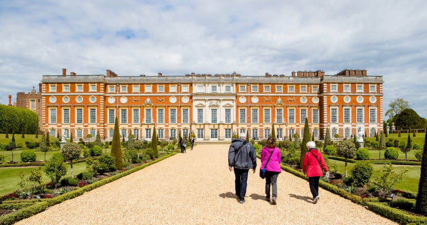 Visitors walking through the Privy Garden towards the South Front