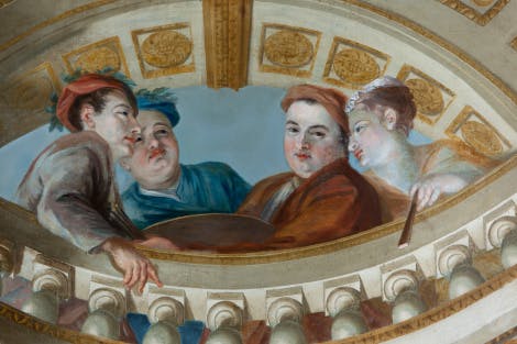 The King's Staircase painted walls detail. Showing a close view of a portrait of William Kent dressed in brown with a turban and holding an artist's palette accompanied by his mistress.