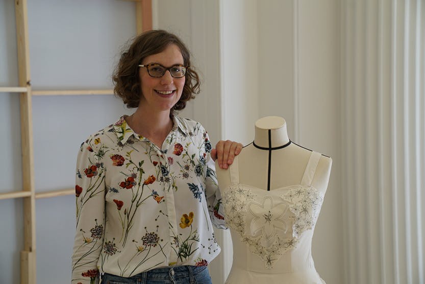 Charlotte Gamper with her toile, inspired by Norman Hartnell who designed many outfits for Her Majesty the Queen, The Queen Mother and Princess Margaret.