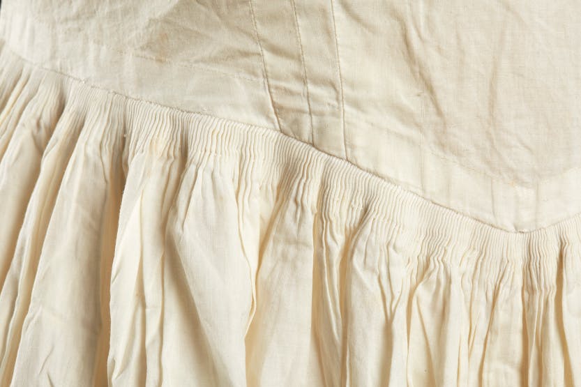 Fine lawn cotton petticoat 1830-45, detail showing pleating. Worn by Queen Victoria (1837-1901).