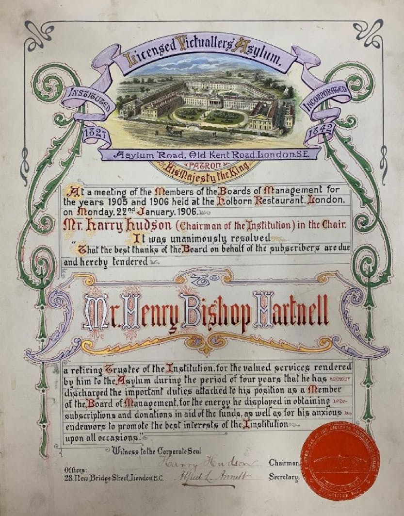 A certificate given to Norman Hartnell’s father, Henry Bishop Hartnell, to mark his retirement as a trustee of the Licensed Victuallers Asylum, 1906. Photographed against a white background.