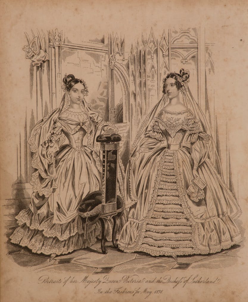 Fashion plate showing Queen Victoria (1837-1901) and the Duchess of Sutherland 'In the Fashions for May 1838'. Shows the beginning of the fashion of the wide skirt which came to typify the Victorian era.

The plate appeared in 'The World of Fashion' and 'Monthly Magazine of the Court of London'.