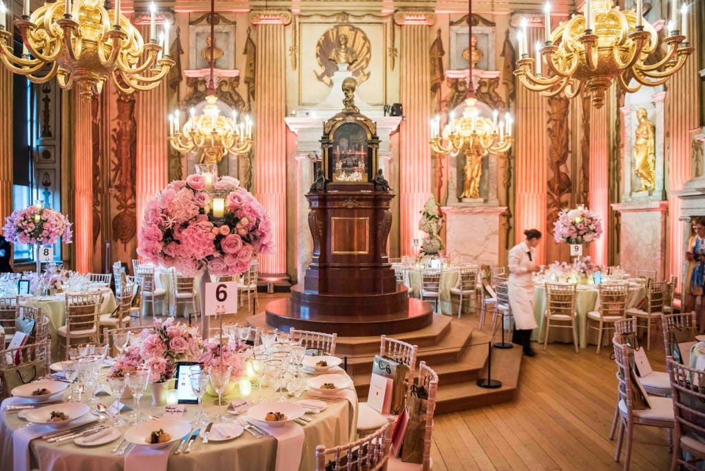 Cupola Room Dinner. Pink florals and round tables.