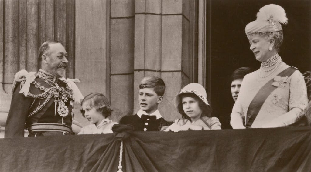 The Silver Jubilee: Sepia-toned photograph of King George V and Queen Mary with their grandchildren on the balcony of Buckingham Palace