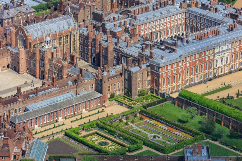 Aerial view of Hampton Court Palace from the south west, showing the Pond Gardens in the foreground.