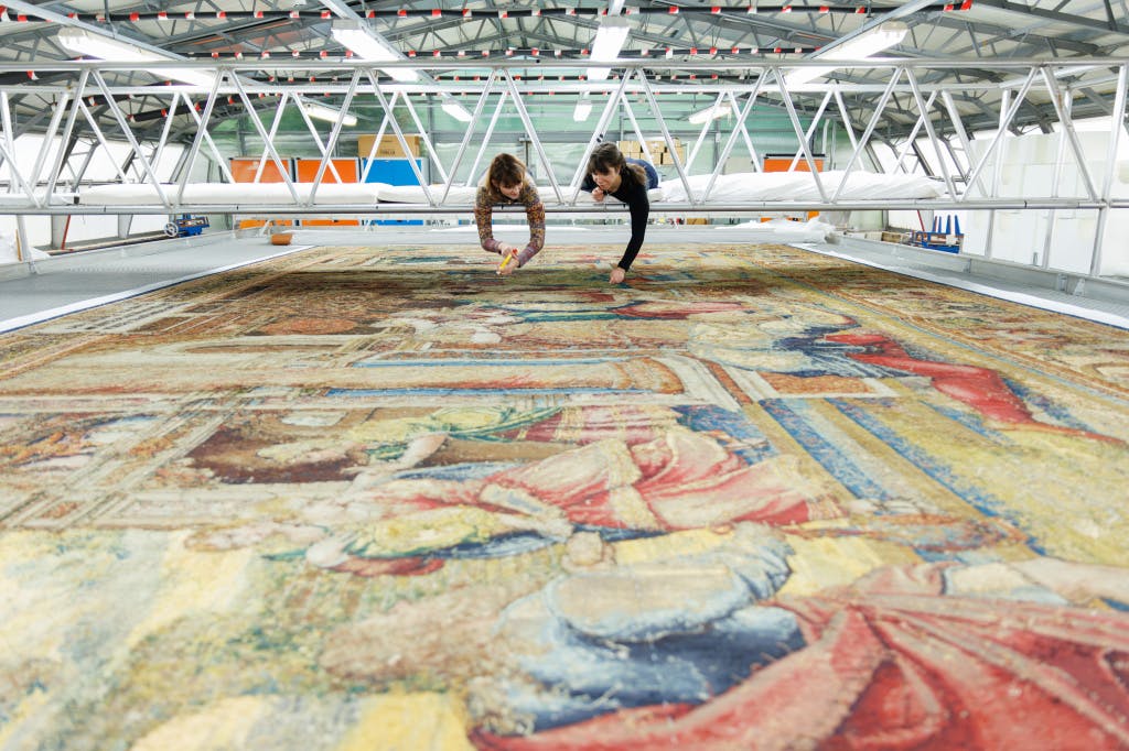 A large tapestry in a conservation studio