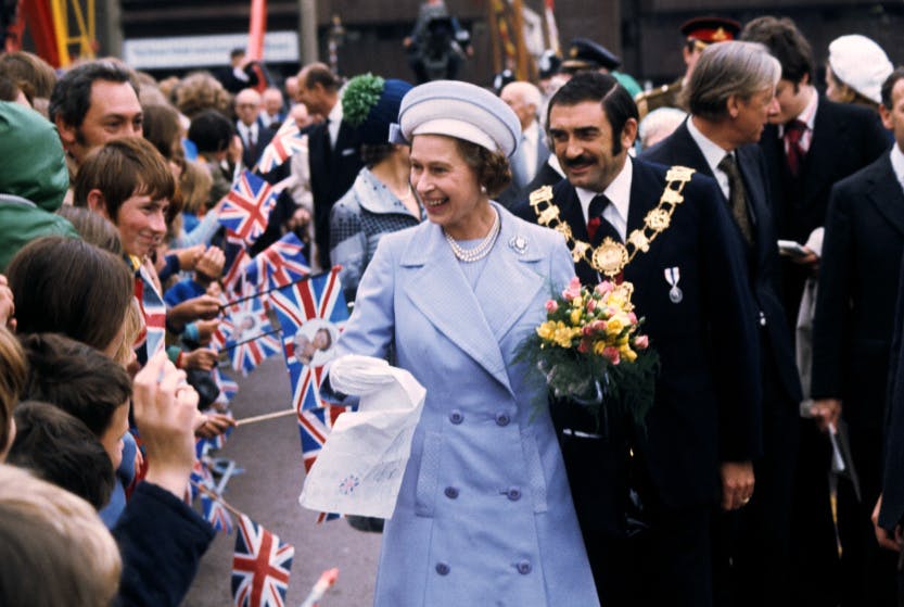 Queen Elizabeth II meets an enthusiastic crowd at St Katharine's Dock near the Tower of London, one of the stops on her Silver Jubilee river progress from Greenwich to Lambeth.
