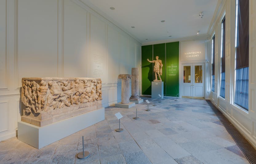 The Lower Orangery Mantegna's Triumphs of Caesar (Andrea Mantegna, 1431-1506) gallery entrance, looking east. Showing the marble sarcophagus with reliefs (Roman, mid-3rd century), the statue of the Roman emperor Hadrian, and fragments of an Ionic column from Daphne (4th century BC) (sculptures).