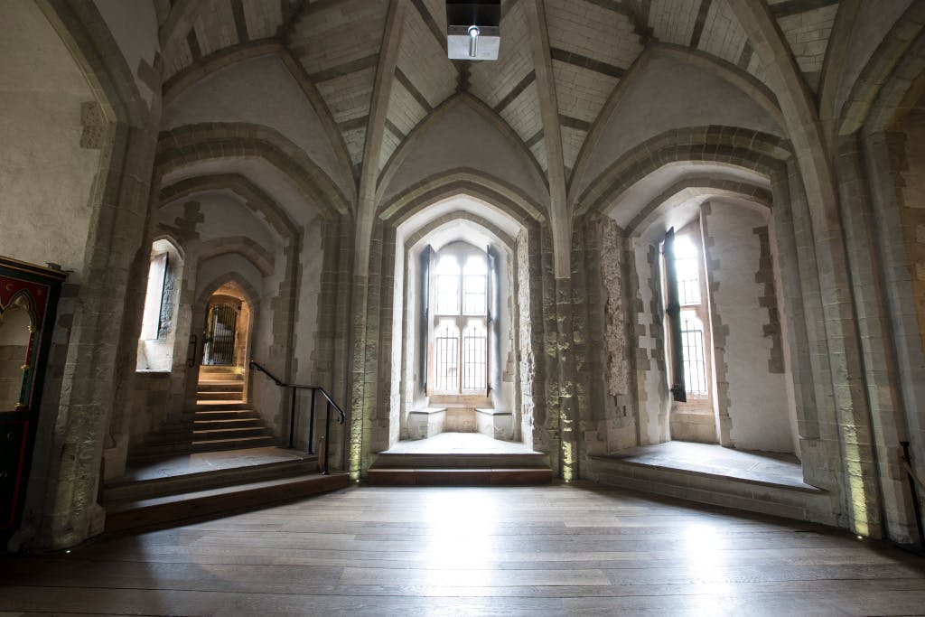 The Wakefield Tower Throne Room, looking south-west. Showing high arched windows. 

The Wakefield Tower was built by Henry III as royal lodgings between 1220 and 1240 and originally sat at the river’s edge. The vaulted ceiling is a 19th-century reconstruction.