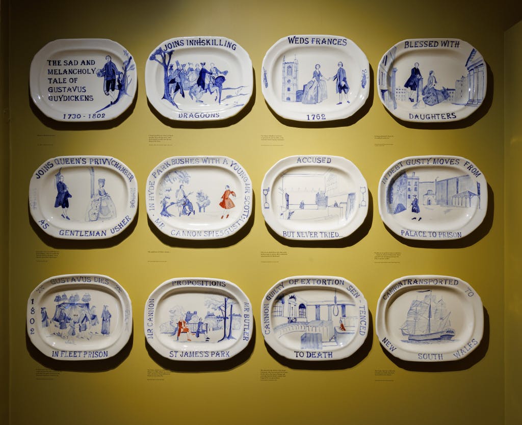 A set of ceramic tiles ( blue and white porcelain) giving a narrative of Gustavus Guydickens life.
