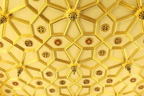 The ceiling of the Great Watching Chamber showing gold decoration and Tudor symbols.