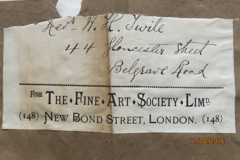 A label found attached to a frame for a print of the Lion Gate at Hampton Court Palace. "The Fine Art Society, New Bond Street, London".