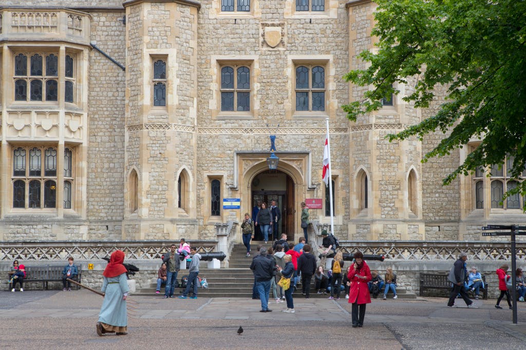 A long-shot general view of a crowd of visitors at the entrance to the Fusilier's Museum located within the Tower of London.