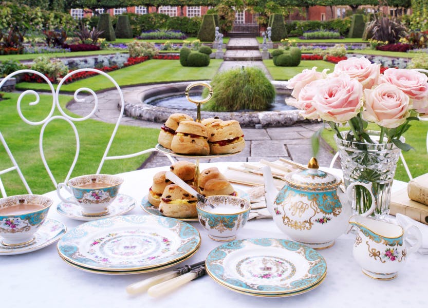 Lifestyle shot of Royal Palace china in a garden at Hampton Court (tea party)