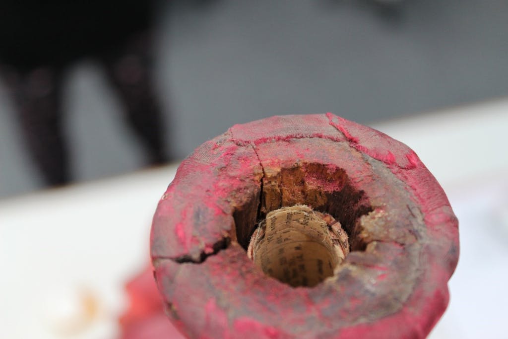 Rolled newspaper in the top of one of the finials.