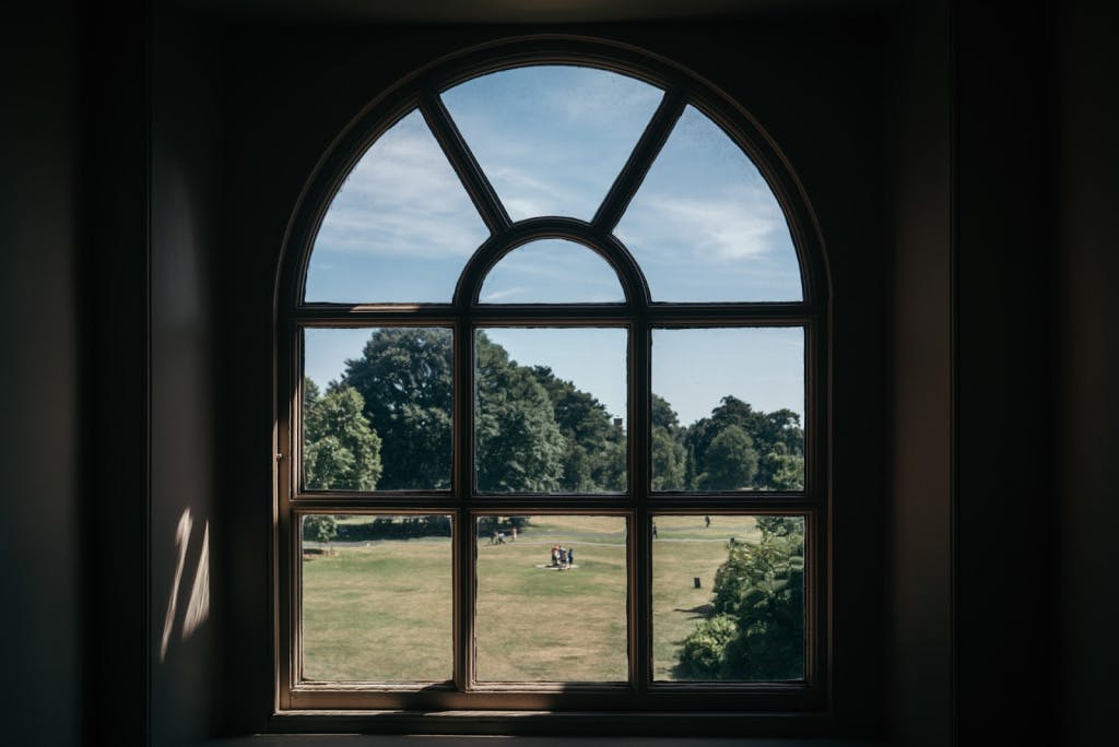 A view out of a first floor window looking out onto a large garden