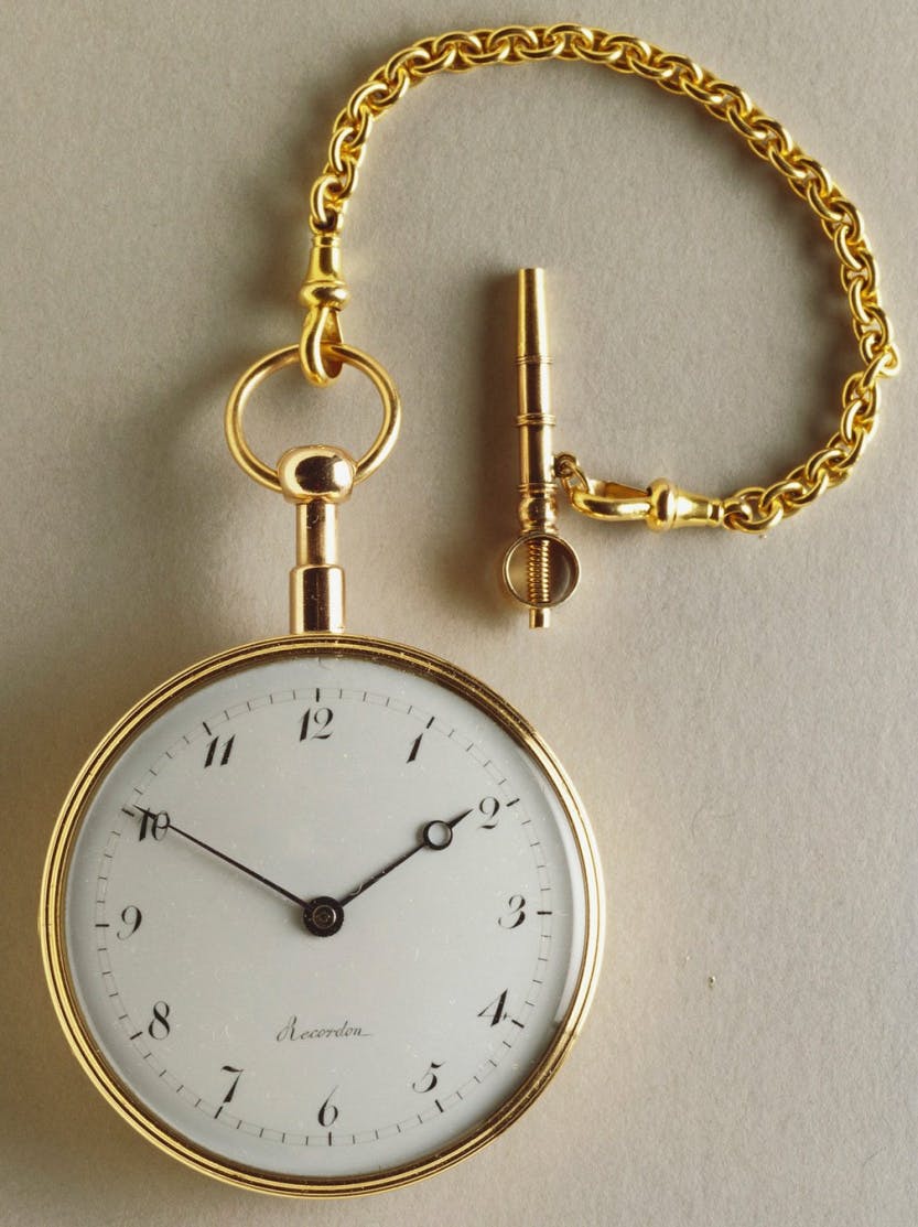 A gold watch with enamel dial