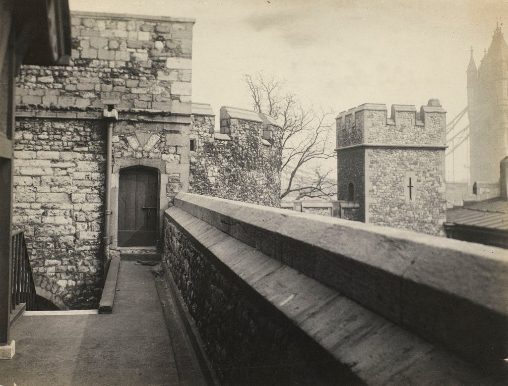 Black and white photograph of Sir Walter Raleigh's Walk and the entrance to the upper chamber of the Bloody Tower.