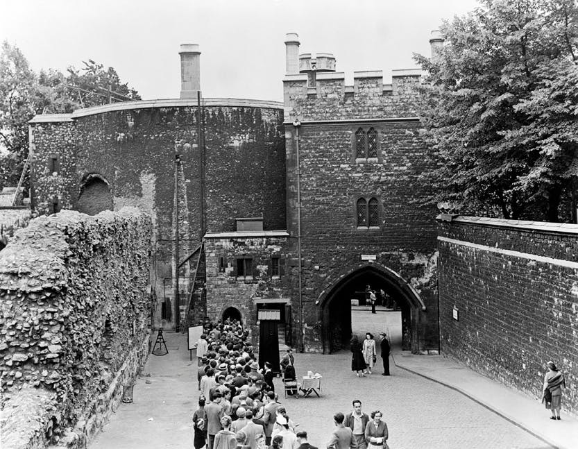 Black and white top shot  photograph of the Bloody Tower and Wakefield Tower from the north showing the queue for the Jewel House in the 1950s.