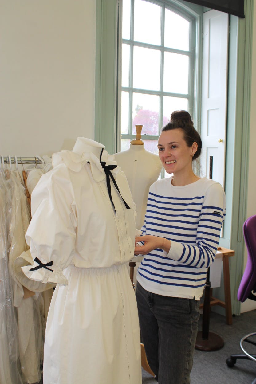 Daisy Graham with her toile inspired by David Emanuel, who designed Diana, Princess of Wale’s wedding dress.