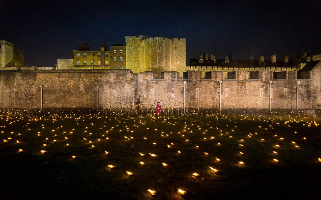 The Tower Moat, showing a high-angle view of the "Beyond the Deepening Shadow" installation. 

“Beyond the Deepening Shadow: The Tower Remembers” was a public act of remembrance to commemorate the centenary of the end of the First World War.

Each evening from 4 to 11 November 2018 the Tower moat was illuminated by 10,000 individual flames. The artistic installation included an exploration in sound of wartime alliances, friendship, love and loss. Beginning with a procession led by the Yeoman Warders, Armistice torches were lit to form a circle of light radiating from the Tower. A symbol of remembrance for the hundreds of thousands who died in the Great War.